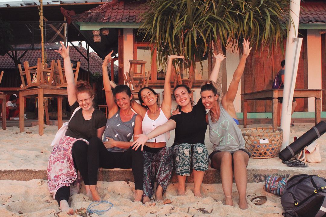 santosha yoga teacher training students on beach nusa lembongan