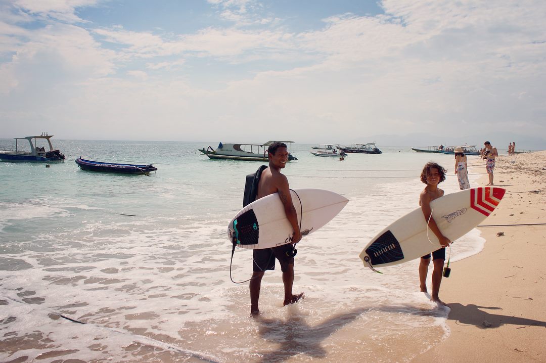 nusa lembongan bali surfers on beach
