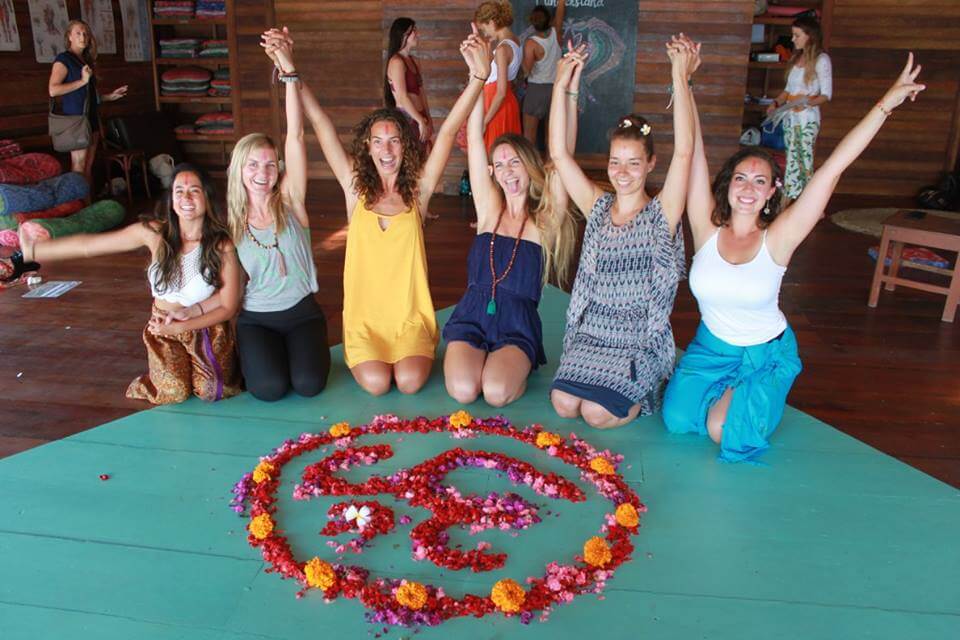 santosha yoga teacher training posing with hands up