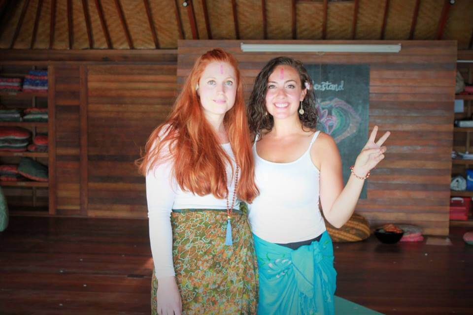 santosha yoga teacher training students smiling peace sign
