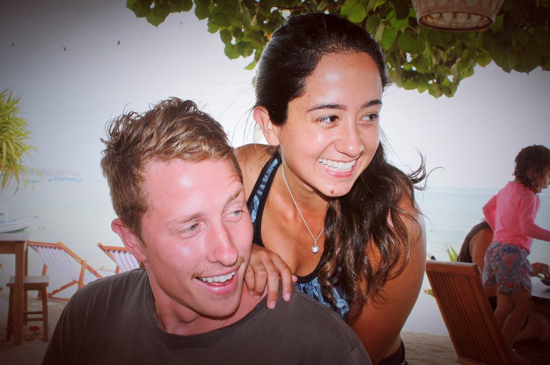 santosha yoga teacher training students on beach smiling couple
