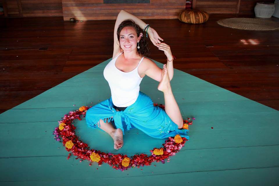 santosha yoga teacher training student yoga pose in flowers