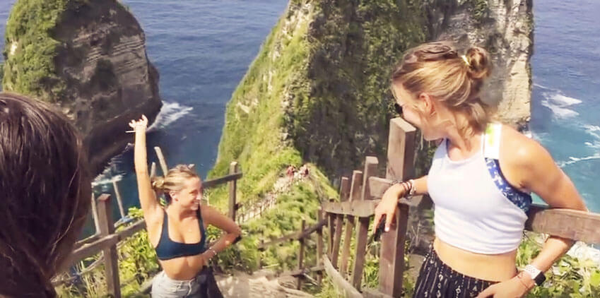 yoga teacher training students on rock in nusa penida