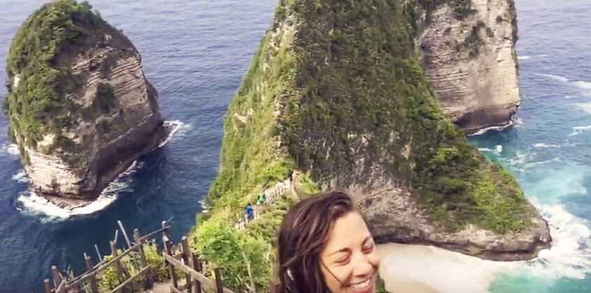 yoga teacher training student on rock in nusa penida