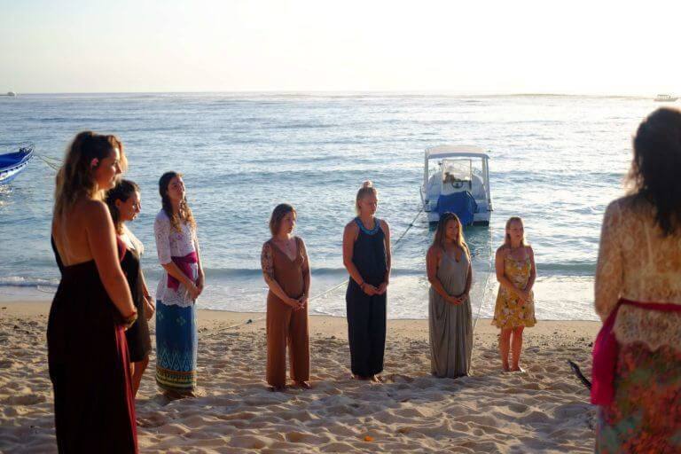yoga teacher training students at graduation on the beach
